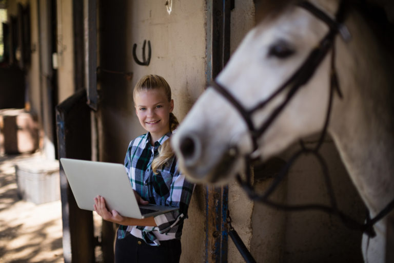 barn girl with computer