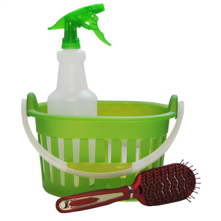 A spray bottle, plastic basket and hair brush.