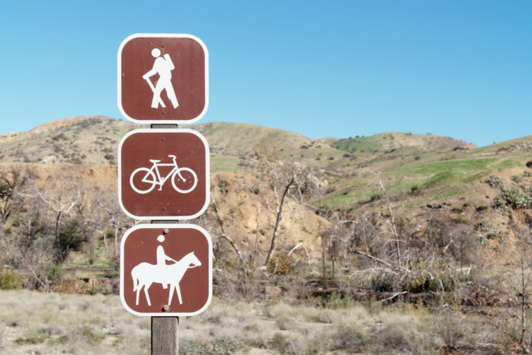 A trail sign for hikers, bikers and horses
