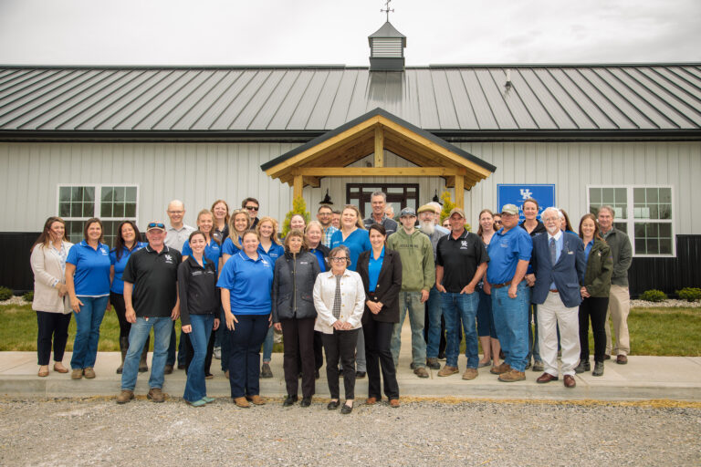 Unveiling of new UK aged horse center with officials posed in front of the facility