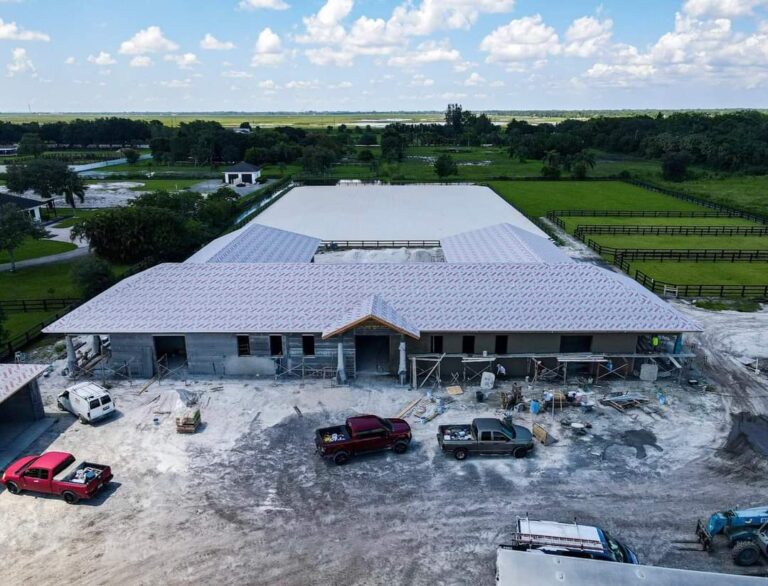 Facade of barn under construction, drone shot