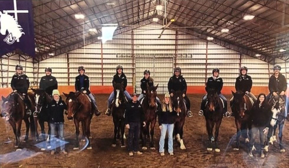 A group of college students on horseback