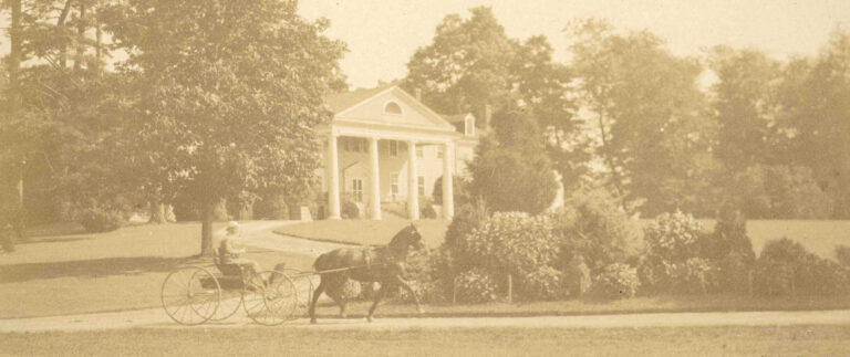 Historical black and white image (sepia toned) of horse and carriage in front of Montpelier manor house in Virginia