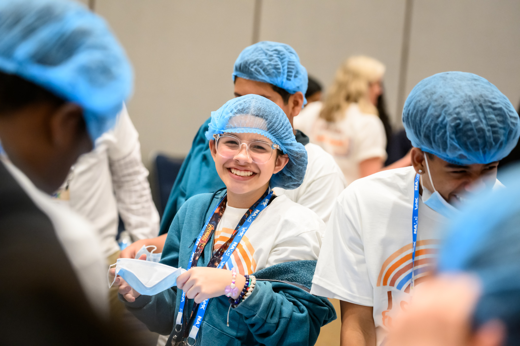 Smiling middle-school student in veterinary scrub suit