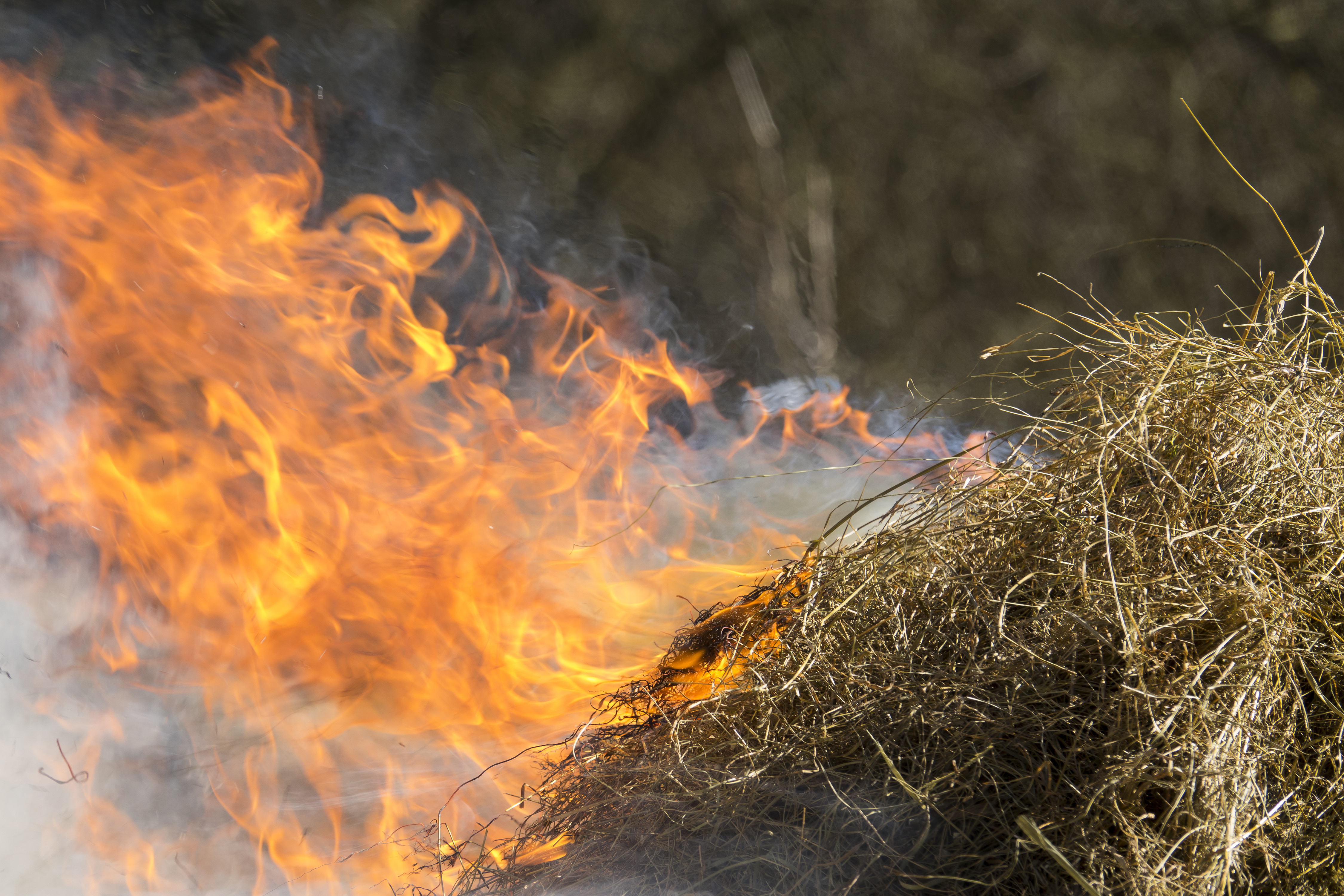 A bale of hay on fire 