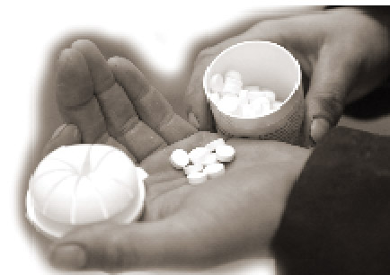 A person holding pills in their hand